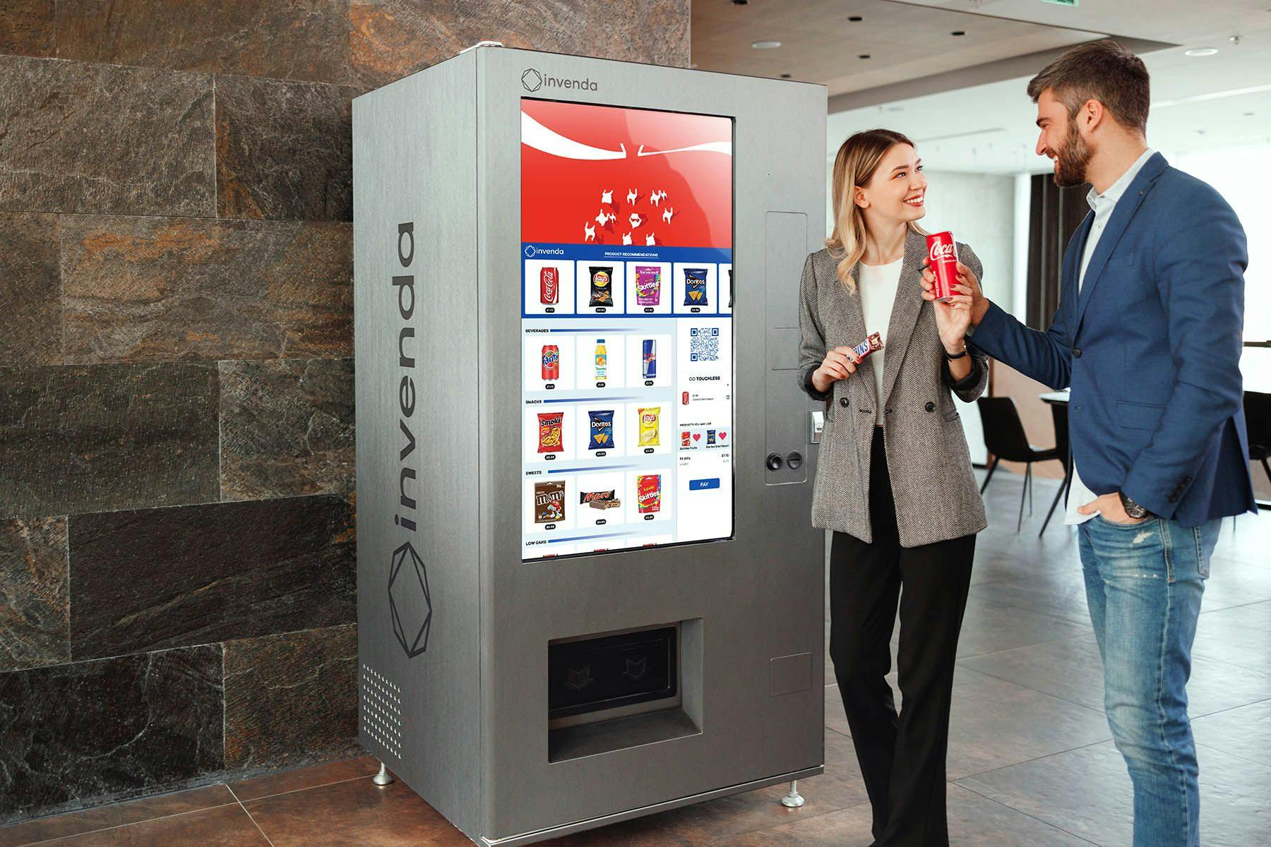 Woman and man in front of smart vending machine